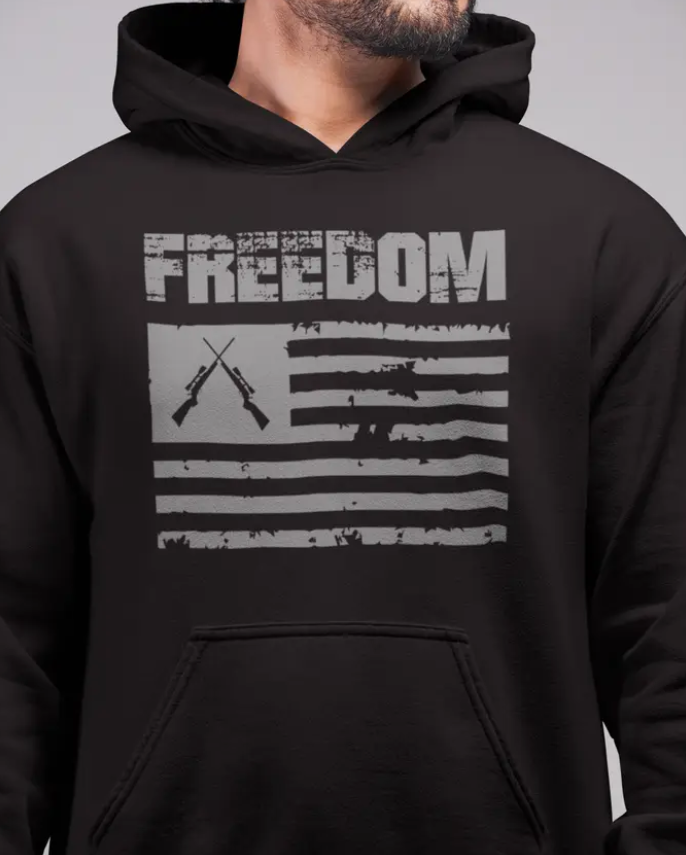 Black hoodie with 'Freedom' text and American flag design on a gray background