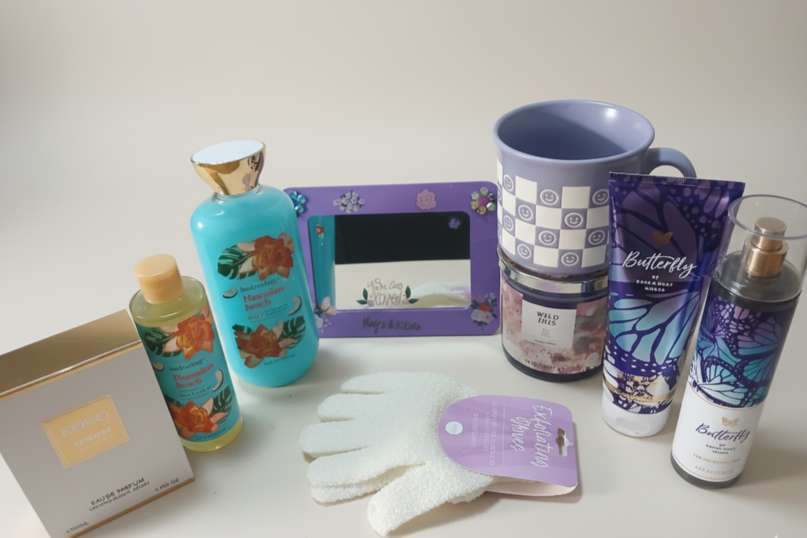 Collection of beauty and self-care products including bottles, a mug, and a photo frame on a white surface.