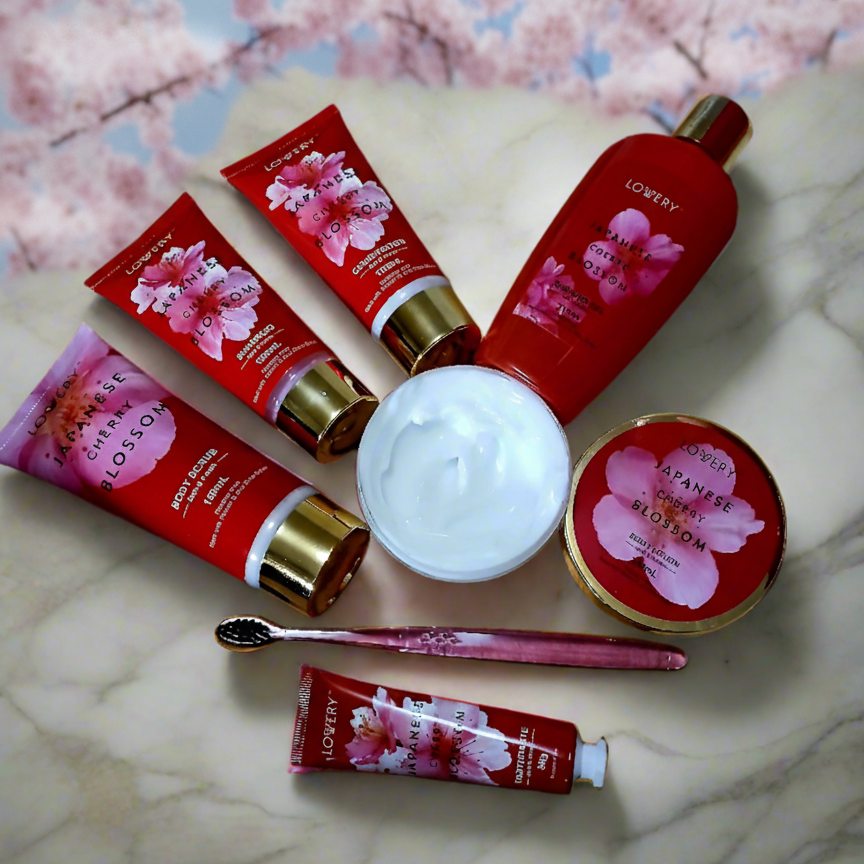 Set of Lowery Japanese Cherry Blossom skincare products on a marble surface with cherry blossom background.