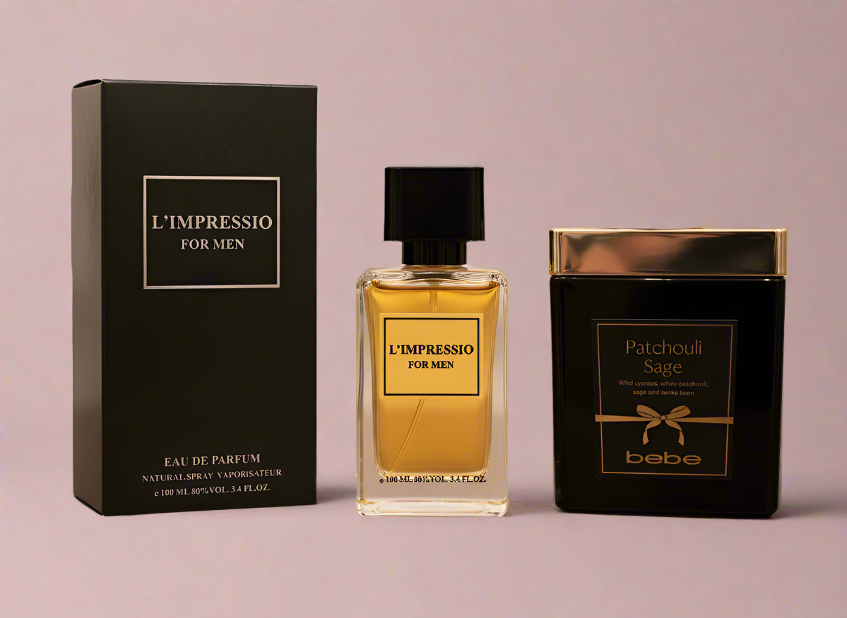 Two perfume bottles and their packaging on a wooden surface with a blurred background