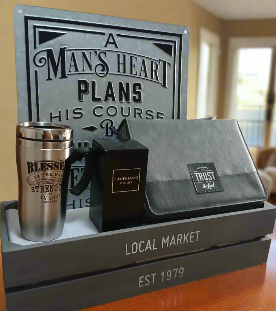 Collection of men's accessories including a wallet, tumbler, and sign on a wooden stand.