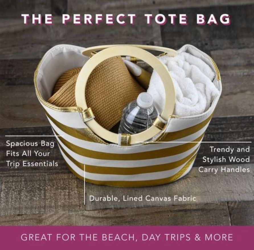Striped tote bag with wooden handles containing a bottle, towel, and basket on a wooden surface.