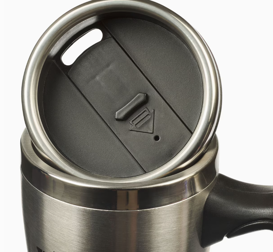 Close-up of a stainless steel travel mug with a black lid on a white background