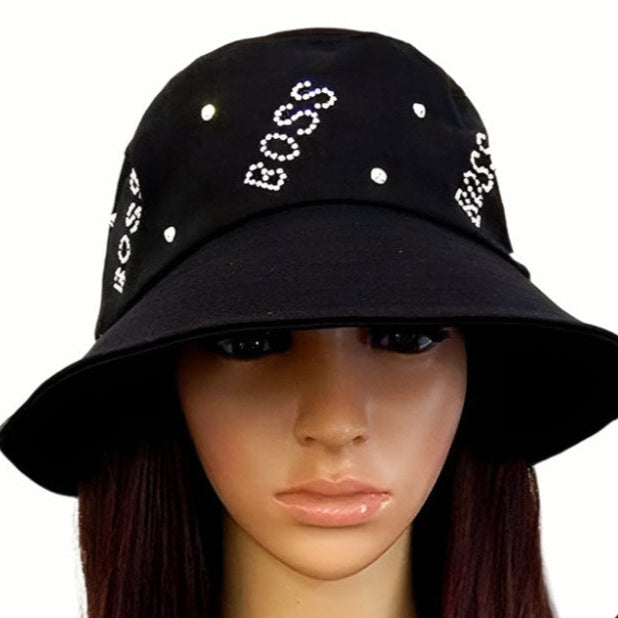 Black bucket hat with 'BOSS' text on a mannequin head against a white background
