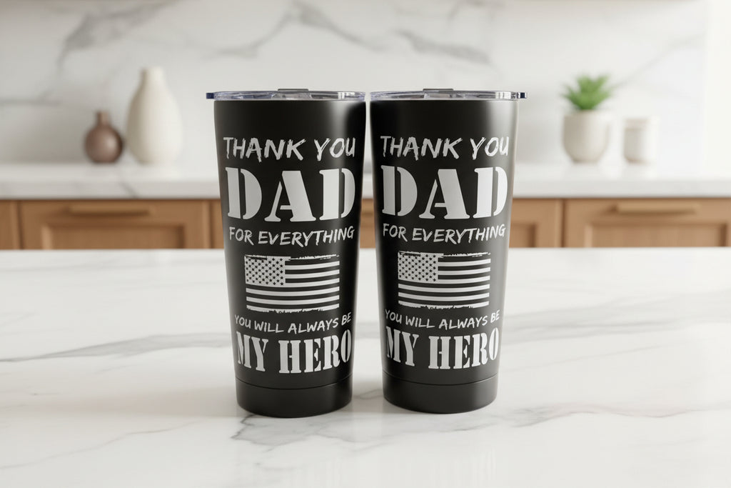 Two black tumblers with 'Thank you Dad' text on a kitchen counter.