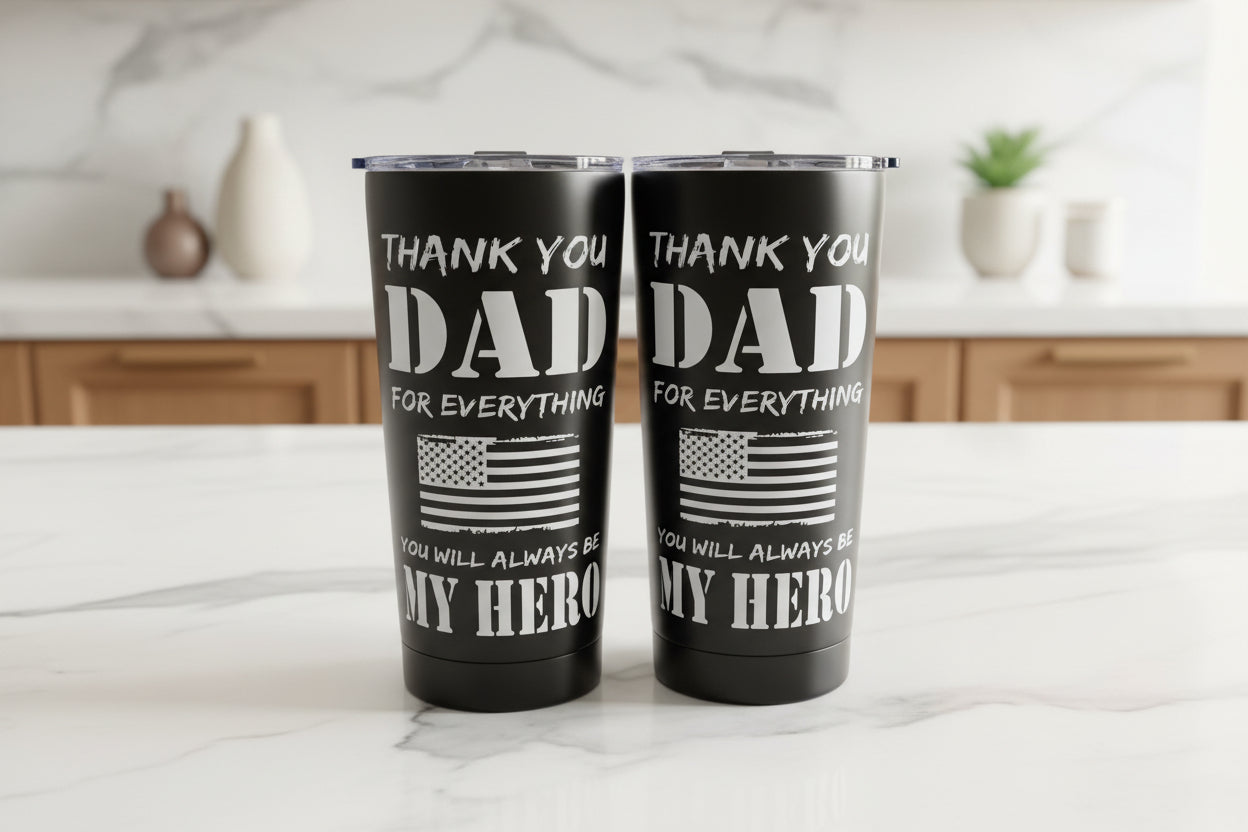 Two black tumblers with 'Thank you Dad' text on a kitchen counter.