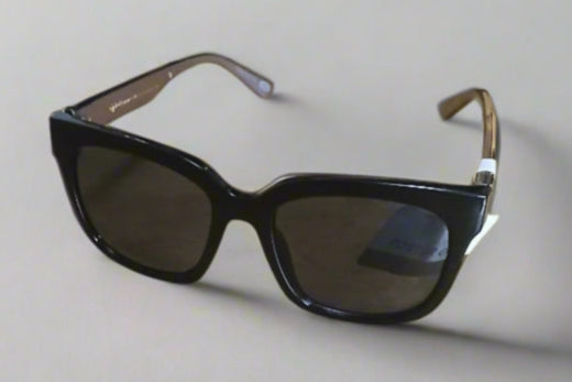 Black sunglasses with gold accents on a light gray background