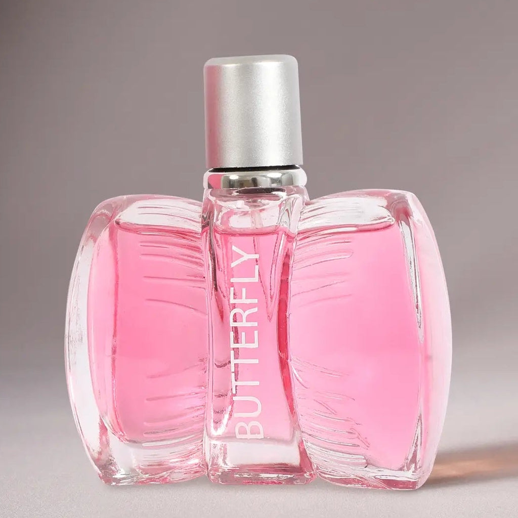 Pink Butterfly perfume bottle with a silver cap, shown on a neutral gray background.