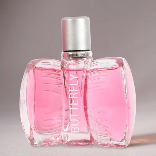 Pink Butterfly perfume bottle with a silver cap, shown on a neutral gray background.