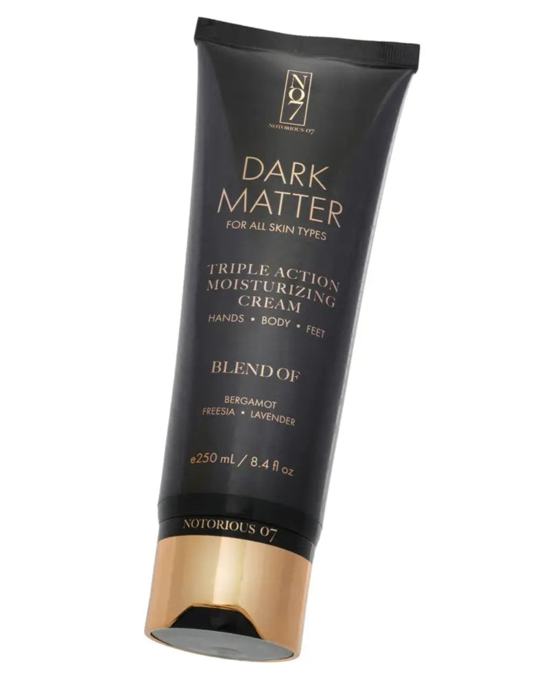 Tube of Dark Matter hair product on a white background