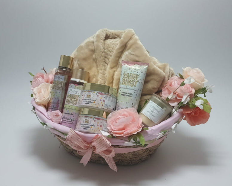 Bath and body gift basket with flowers on a wooden table